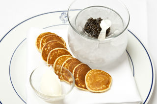 Ossetra caviar with blinis and sour cream