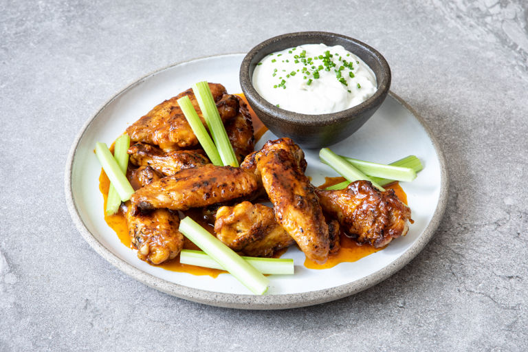 BBQ buffalo wings with celery and blue cheese dip 