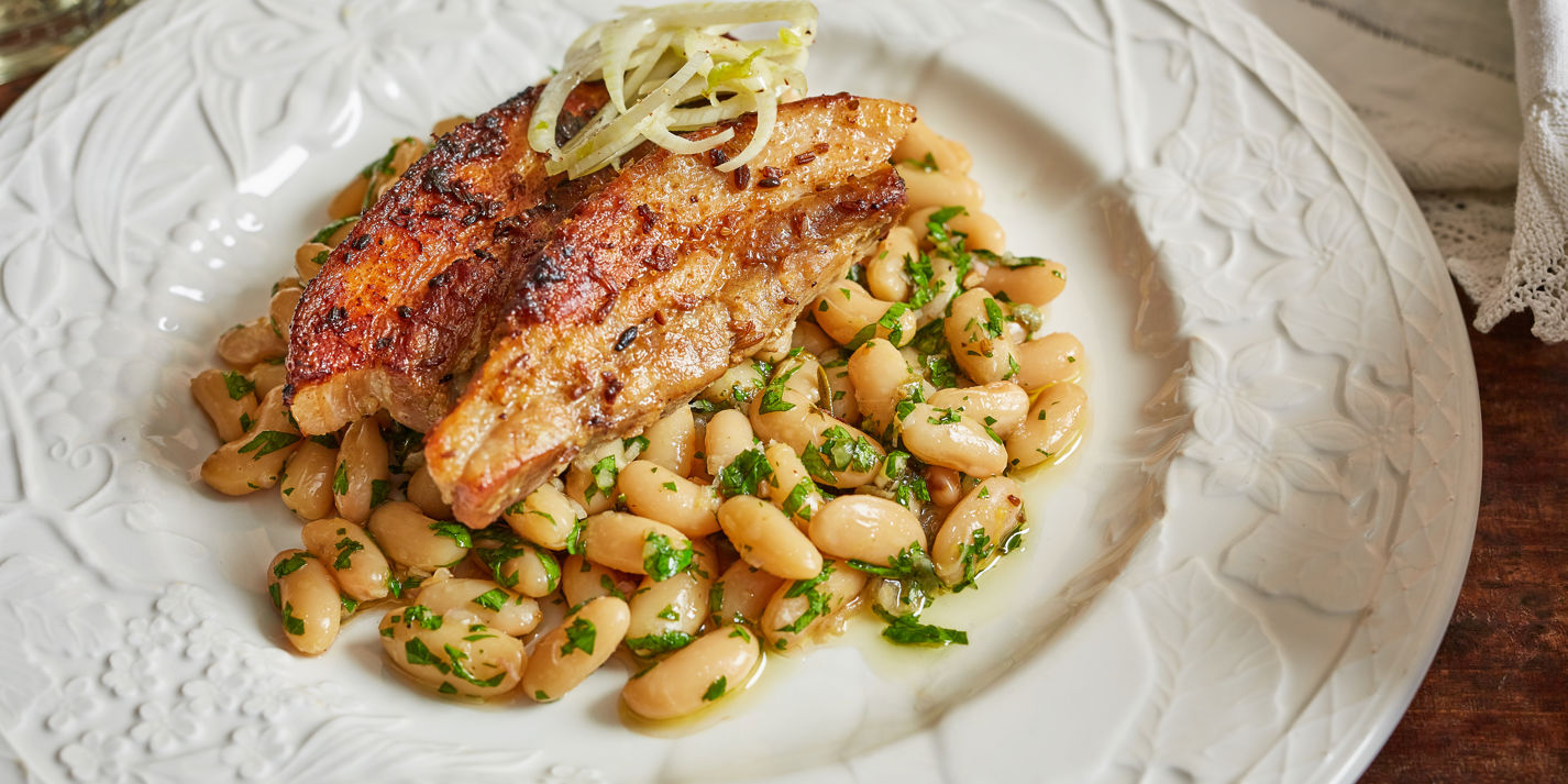 Confit pork belly with cannellini beans & rosemary recipe