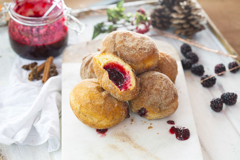 Cinnamon doughnuts with blackberry jam