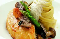 Pot-roasted maize-fed chicken with wild mushrooms, asparagus spears and truffle tagliatelle