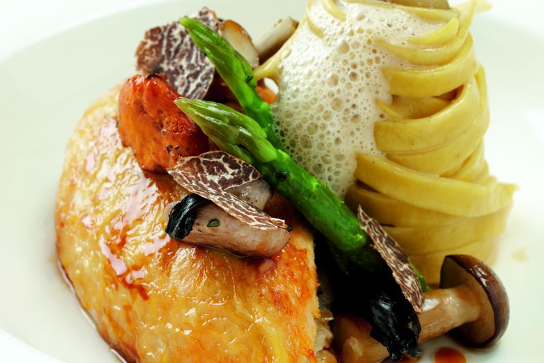 Pot-roasted maize-fed chicken with wild mushrooms, asparagus spears and truffle tagliatelle