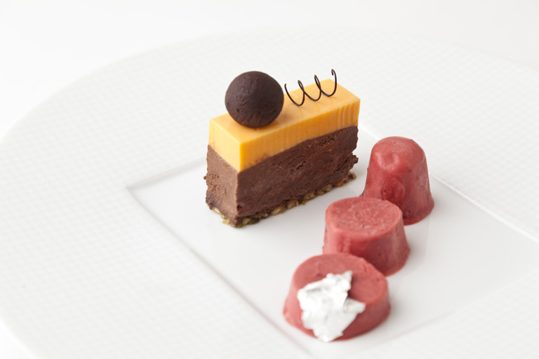 Whisky truffle, dark chocolate-chikki delice, orange mousse and cranberry kulfi