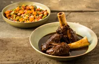 Braised venison shanks with 'three sisters' and wild boar bacon