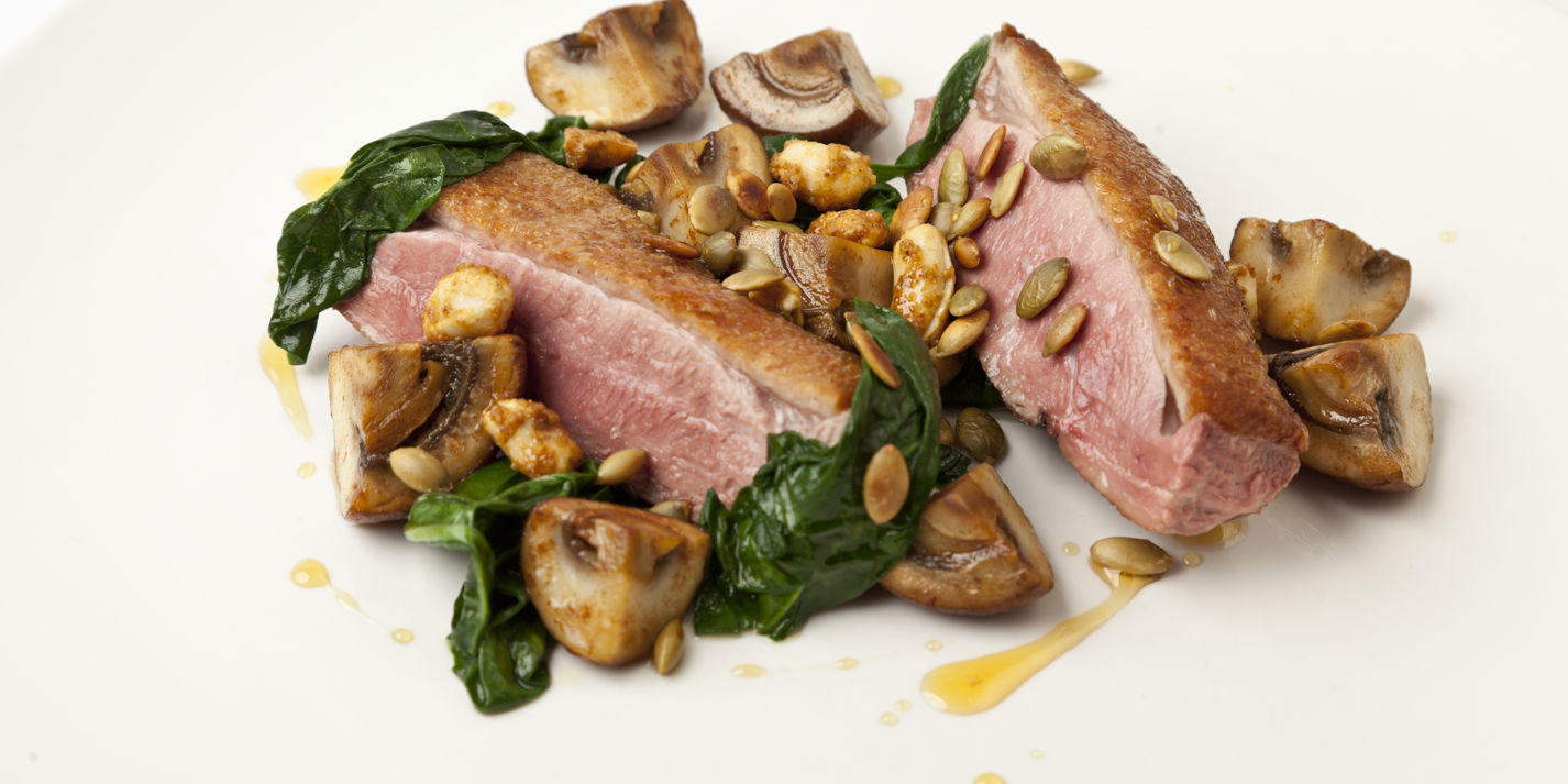 Seared duck breast with sautéed and pickled mushrooms, pumpkin seeds and toasted peanuts