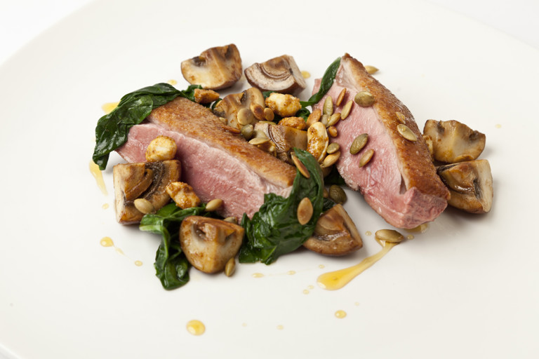 Seared duck breast with sautéed and pickled mushrooms, pumpkin seeds and toasted peanuts