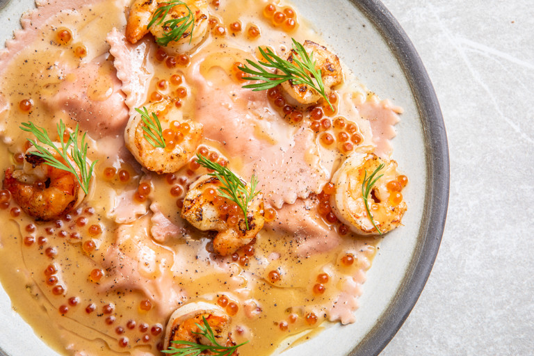 Pink king prawn ravioli with champagne beurre blanc