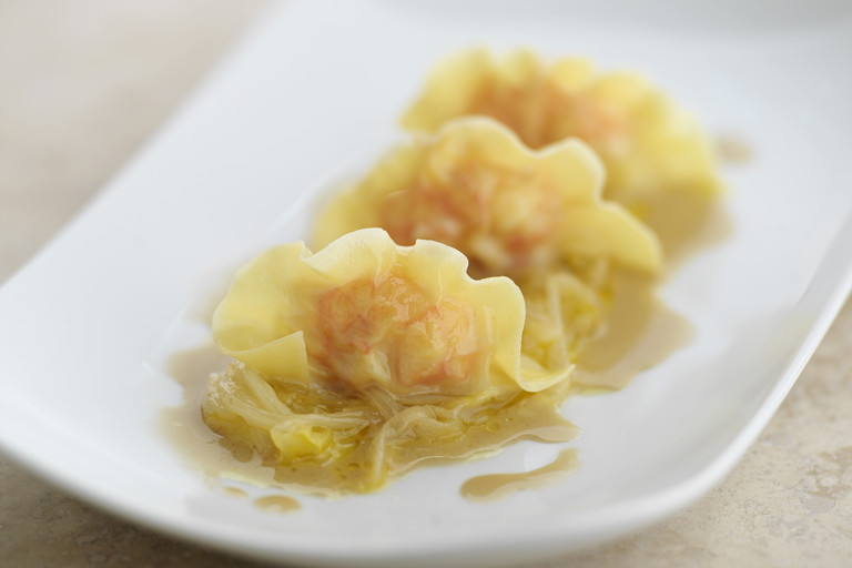 Langoustine ravioli, braised orange endive and langoustine jus