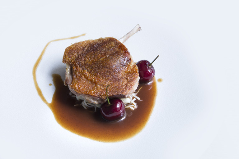 Duck leg with celeriac choucroute, bulgar wheat and cherries