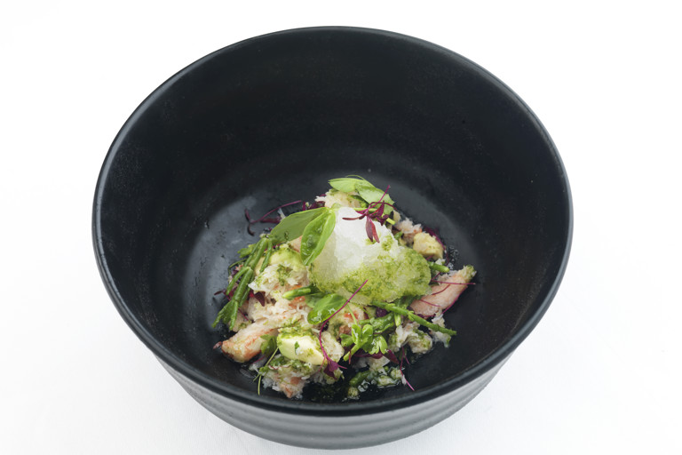 Alaska king crab with micro herb salad and tomato consommé granita