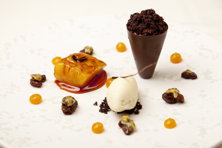 Poached pineapple, Michel Cluizel cones, cicely ice cream, rum raisin and passion fruit