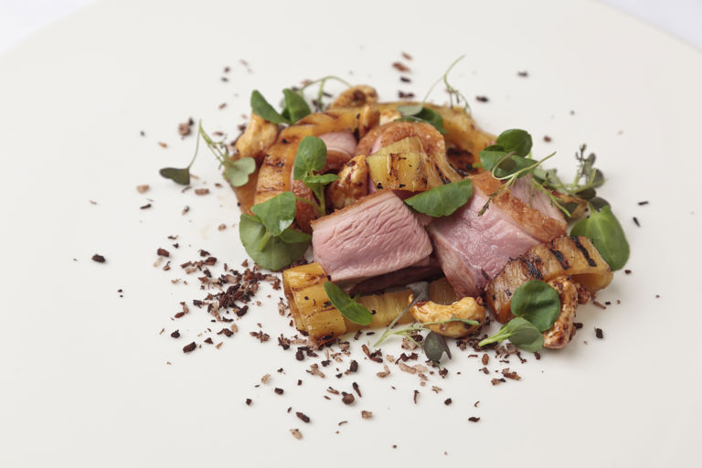 Duck breast salad with burnt coconut, pineapple and cashews