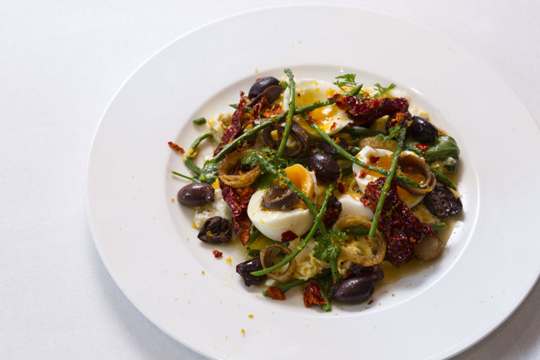 Warm egg salad with wild asparagus, olive and chilli