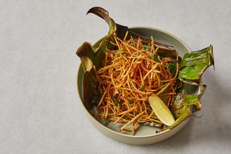 Steamed coconut and chilli sea bass with shoestring fries
