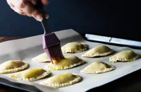 Brush the mini pies with the egg mixture