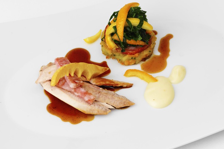 Roast partridge with cabbage, citrus, spiced sausage and bamboo