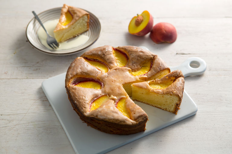 Olive oil cake with peaches and a lemon glaze