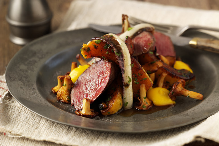 Roast loin of venison with butternut squash, girolles and roast treviso