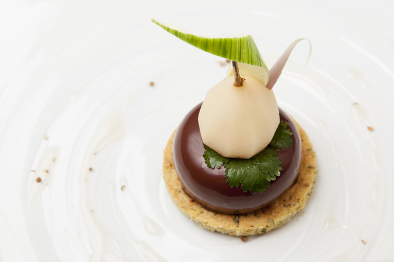 Pear with lemongrass, herbs, and dark bitter chocolate