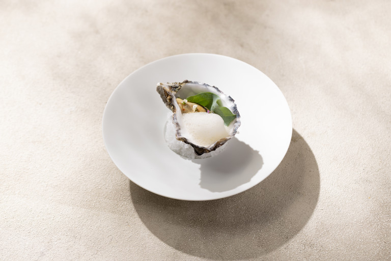Marinated oyster with chilli, tamarind and peanut dressing
