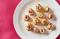 Mini baked potatoes with sour cream, chive and bacon