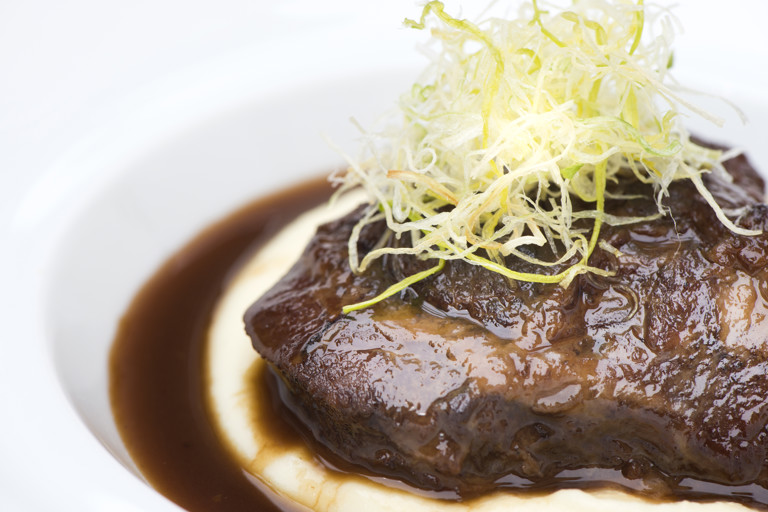 Braised veal cheek, potato purée and fried leeks