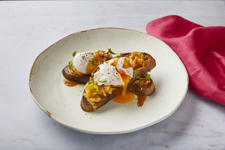 Poached egg, kimchi and almond butter on sourdough toast