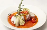 Gigot of monkfish with tomato and pepper sauce