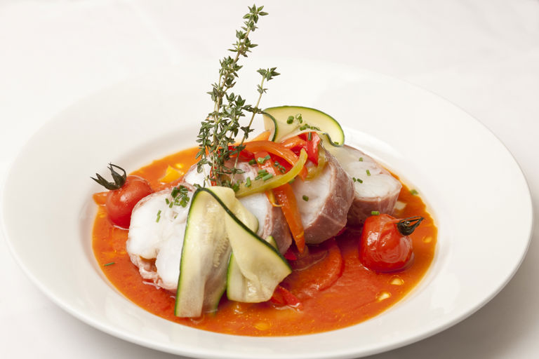 Gigot of monkfish with tomato and pepper sauce