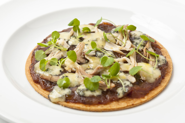 Hot turkey and caramelised onion tart with melting Stilton cheese