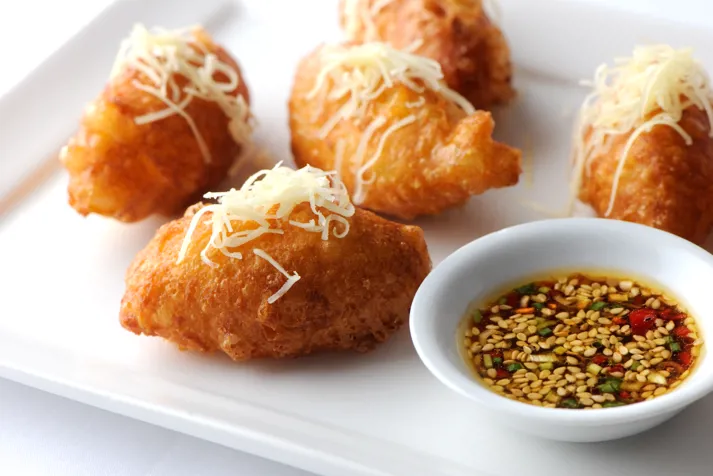 Cheddar beignets with sesame dressing