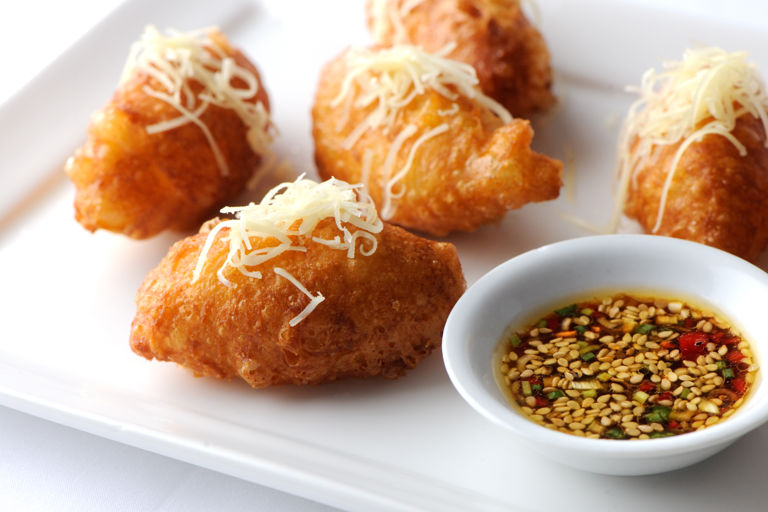Cheddar beignets with sesame dressing
