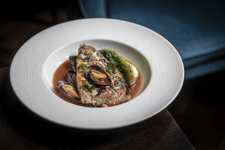 Kokum-crusted halibut with mussel rasam and bok choy