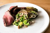 Barbecued rump cap with broad beans a la Francaise and pickled mushrooms