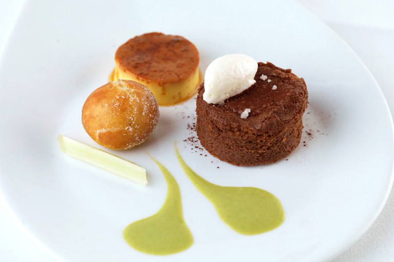 Salted chocolate délice with crème caramel and an apple fritter