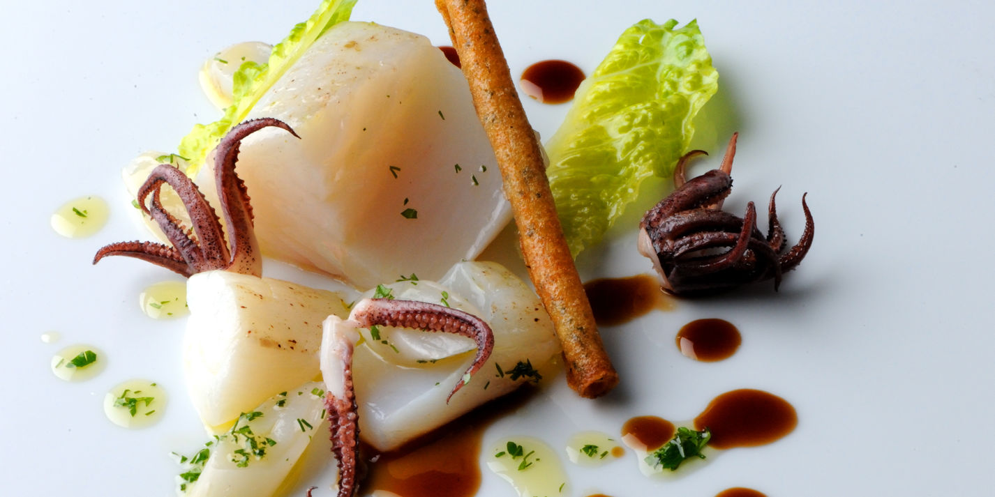 Salt cod poached in olive oil with langoustine cigars and hermitage jus