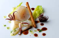 Salt cod poached in olive oil with langoustine cigars and hermitage jus