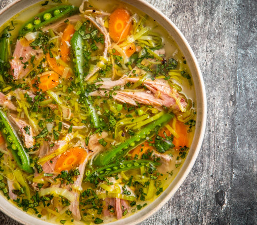 Ham hock and spring vegetable broth with pickled chillies