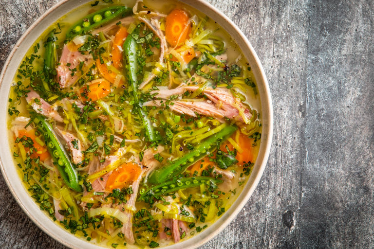 Ham hock and spring vegetable broth with pickled chillies