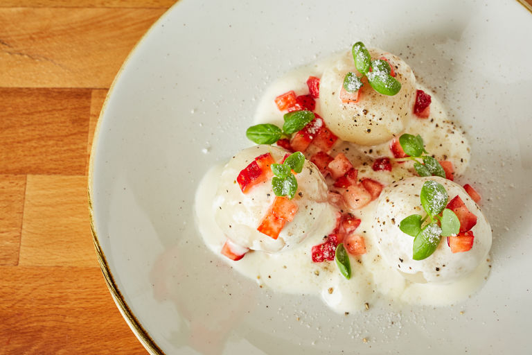 Strawberry and potato dumplings with basil and sour cream