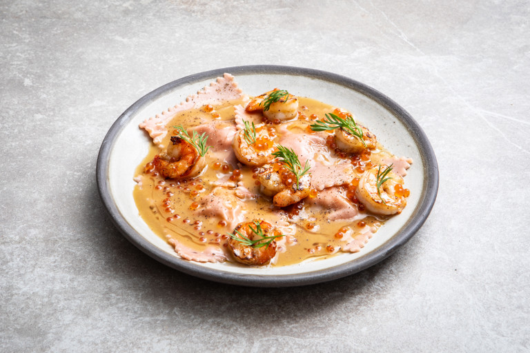 Pink king prawn ravioli with champagne beurre blanc
