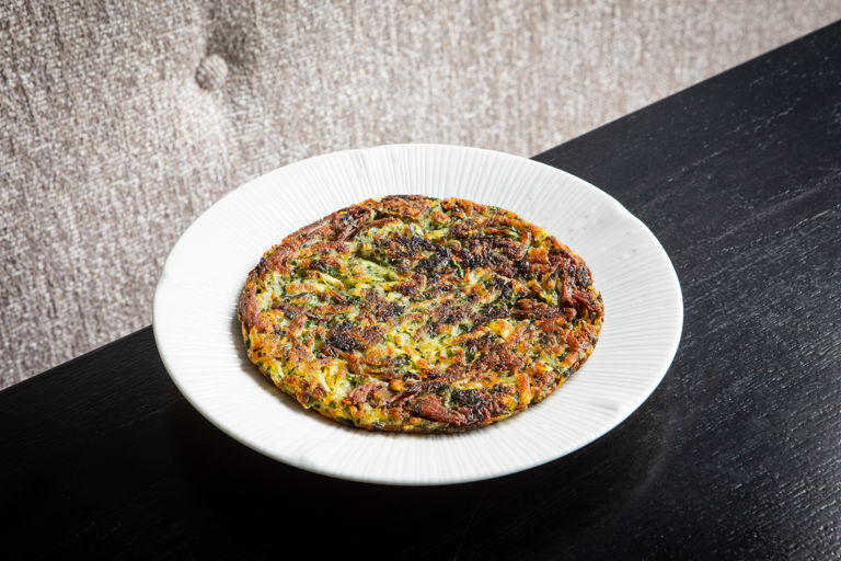 Potato rosti with duck confit and herbs