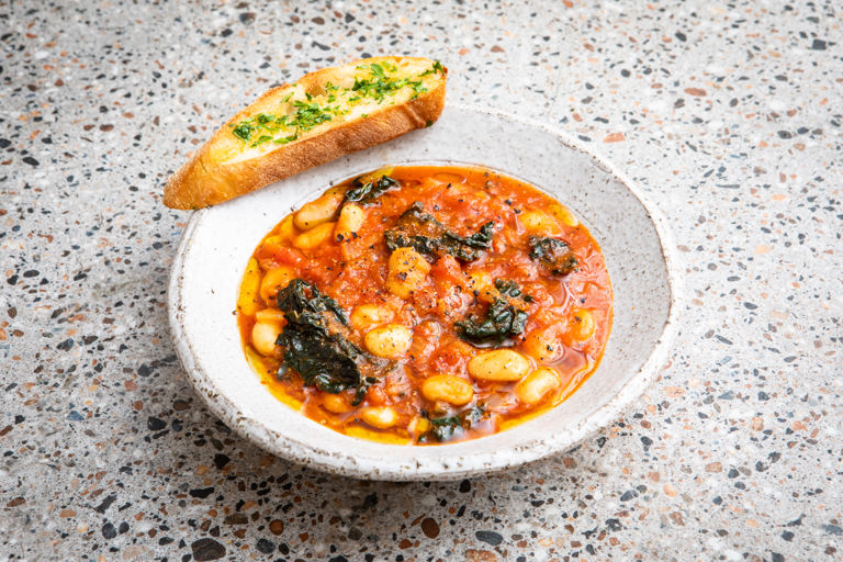 Smoky butter bean stew with kale and garlic-parsley toasts 