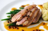 Duck breast with passion fruit sauce and crushed new potatoes