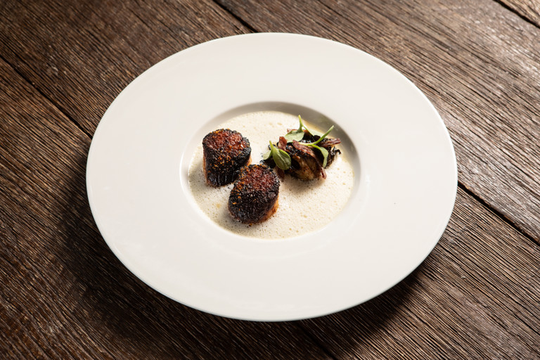 Scallops with jamón sauce and cocoa pod and dashi vinegar glaze