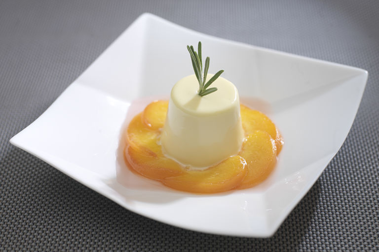 Poached peaches with rosemary cream