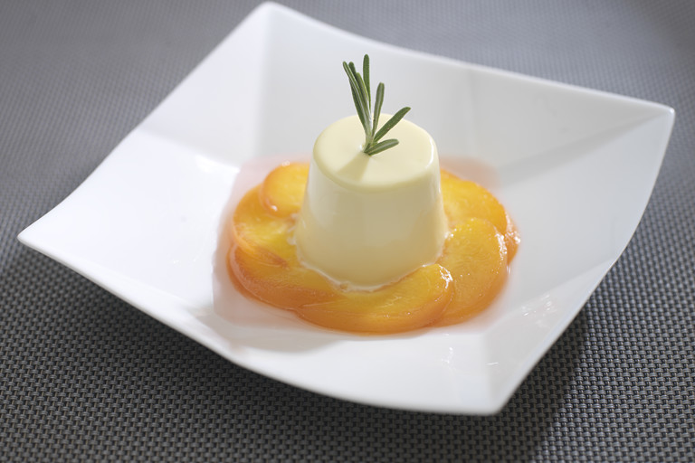 Poached peaches with rosemary cream