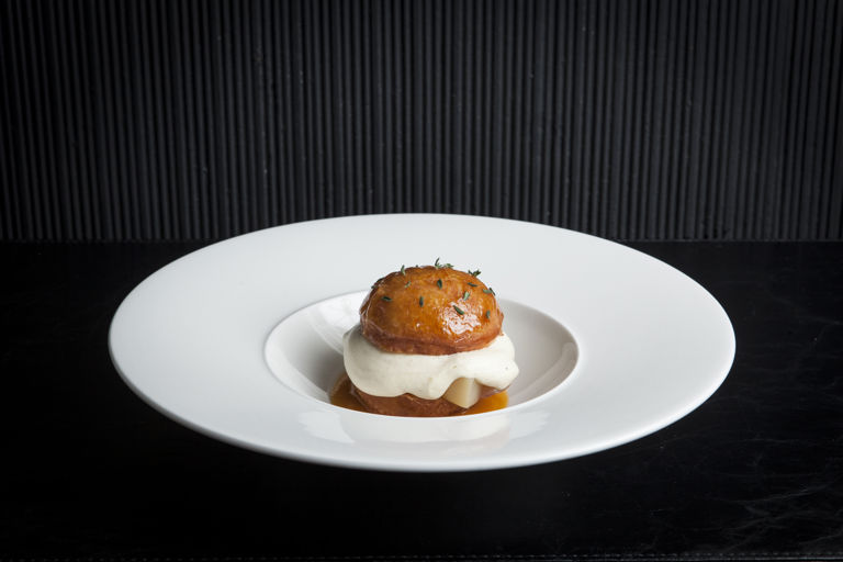 Brioche doughnut with poached peaches and meadowsweet crème diplomat