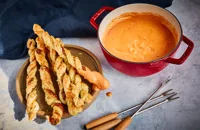 Gruyère and tomato fondue with pesto cheese straws	