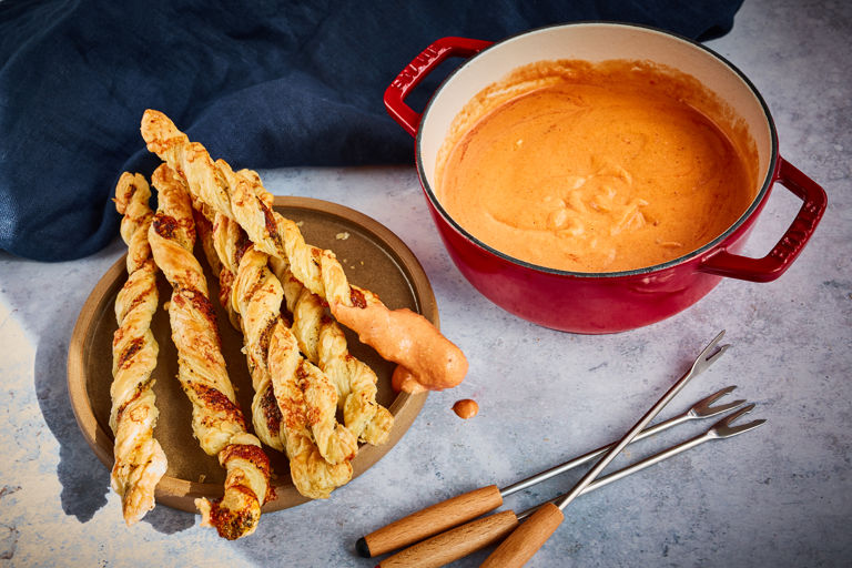 Gruyère and tomato fondue with pesto cheese straws	